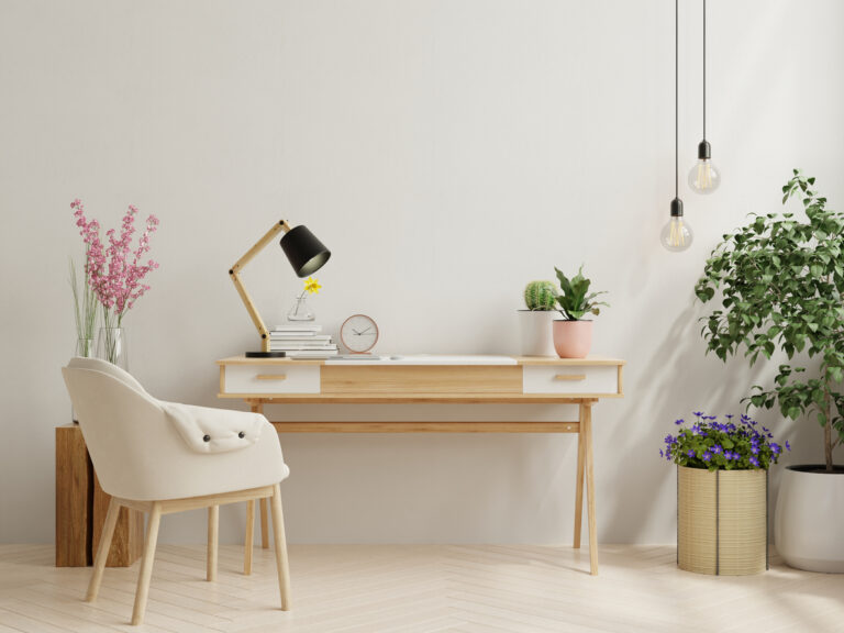 Office desk interior with mockup white wall.